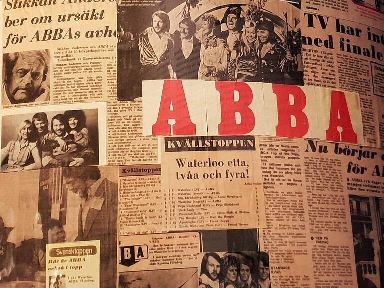Image a newspaper featuring ABBA.
