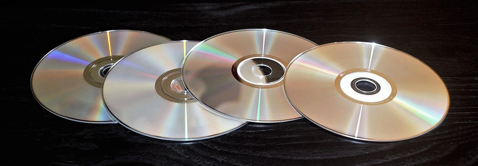 An image of four DVDs on a black background.