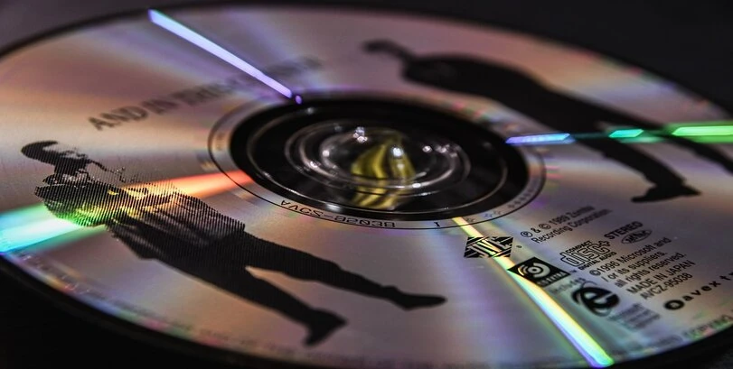 An image of a silver CD from an album.