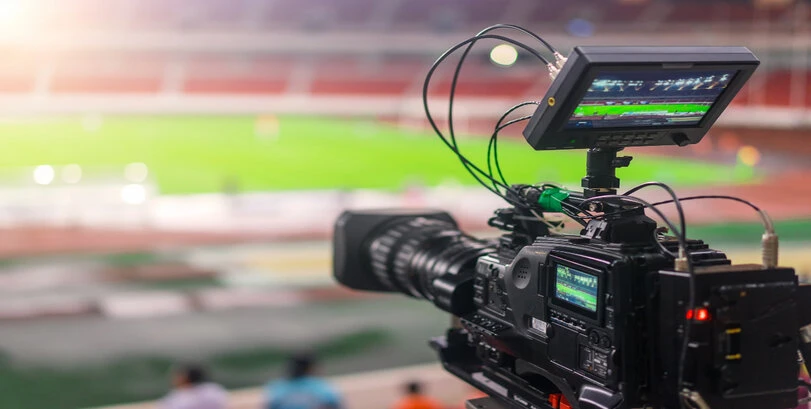 A video camera recording a football match.